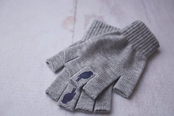 Grey Fingerless Gloves with a Navy colored bird on the middle finger; Nail color Dark Red