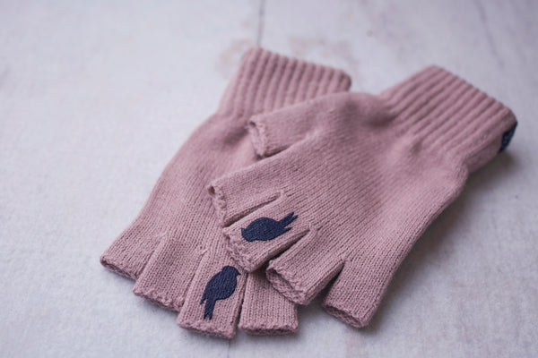 Two stacked Pink Fingerless Gloves with a Navy colored bird on the middle finger
