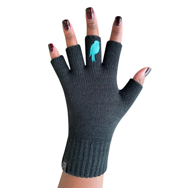 Black Fingerless Gloves with a teal colored bird on the middle finger; Nail color is a dark red